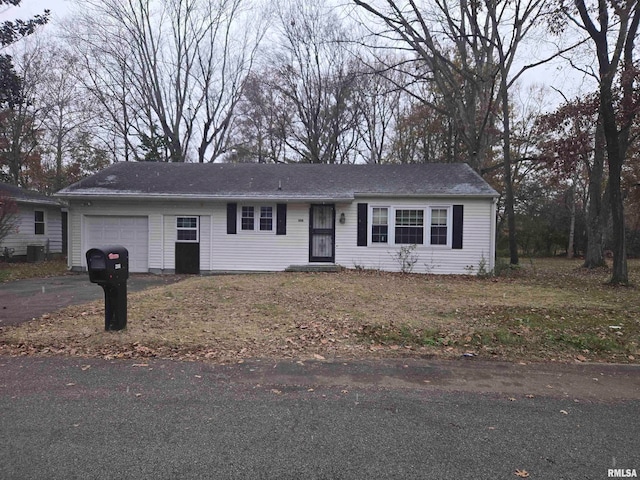 single story home featuring a garage