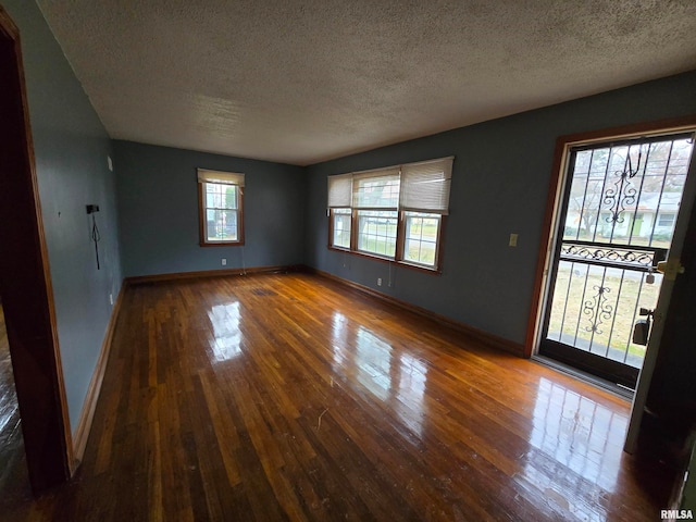 interior space featuring hardwood / wood-style floors and a textured ceiling