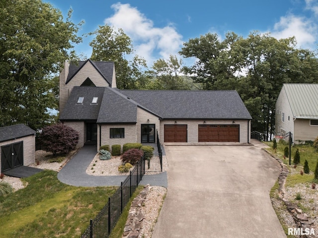 12225 Pebble Point Rd, Marion, IL 62959 - view of front of property featuring a shingled roof, a chimney, concrete driveway, a garage, and brick siding