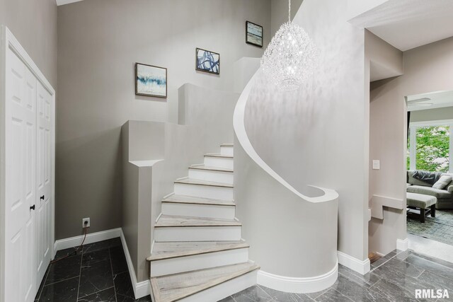 12225 Pebble Point Rd, Marion, IL 62959 - stairway with baseboards, a chandelier, and marble finish floors