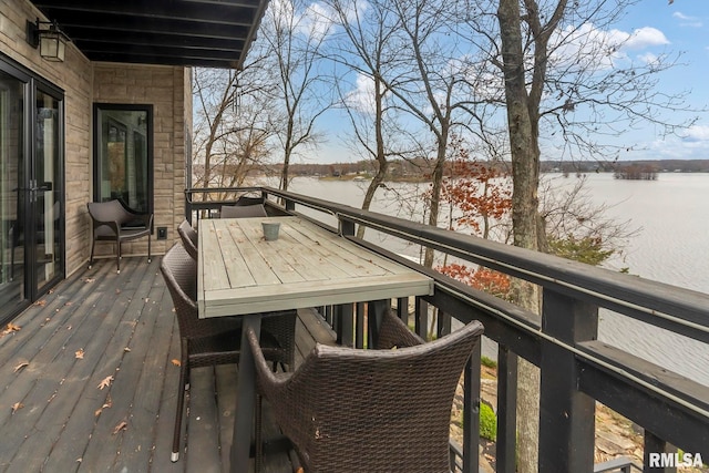 wooden deck with a water view