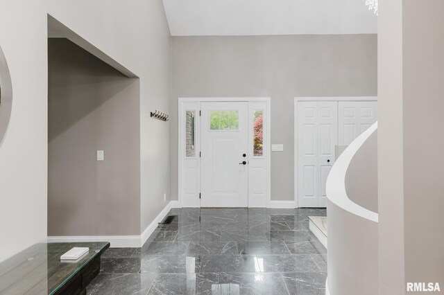 12225 Pebble Point Rd, Marion, IL 62959 - entryway featuring baseboards, marble tiled floors, and a towering ceiling