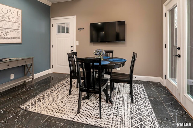 dining area with ornamental molding