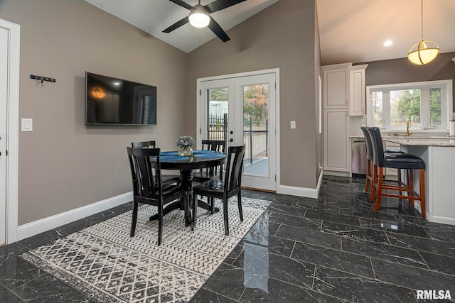 dining area with french doors, vaulted ceiling, and ceiling fan