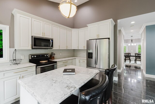 12225 Pebble Point Rd, Marion, IL 62959 - kitchen featuring stainless steel appliances, a kitchen island, tasteful backsplash, white cabinetry, and recessed lighting