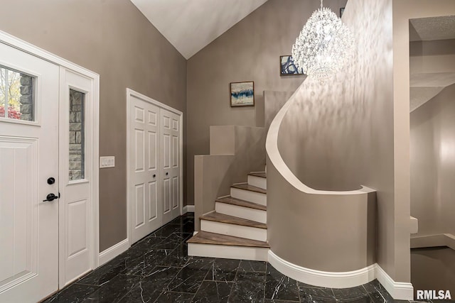 foyer featuring vaulted ceiling