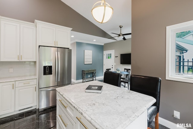 12225 Pebble Point Rd, Marion, IL 62959 - kitchen with stainless steel fridge with ice dispenser, ceiling fan, baseboards, white cabinets, and a kitchen island