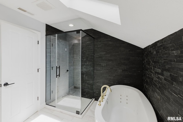 12225 Pebble Point Rd, Marion, IL 62959 - bathroom with a tub with jets, a stall shower, vaulted ceiling, a skylight, and recessed lighting