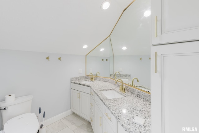 12225 Pebble Point Rd, Marion, IL 62959 - bathroom with marble finish floors, double vanity, baseboards, toilet, and recessed lighting