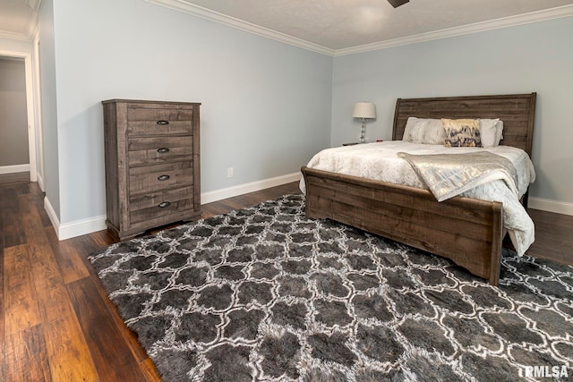 bedroom featuring dark hardwood / wood-style floors, ceiling fan, and crown molding