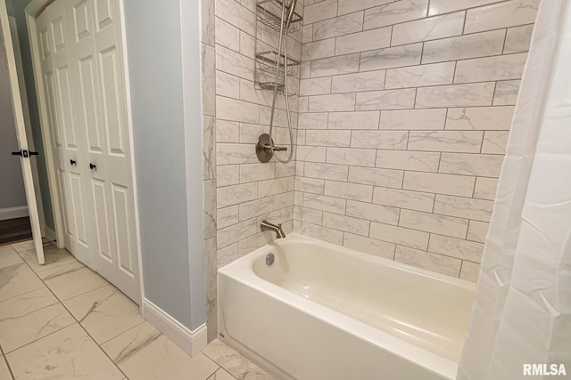 bathroom with shower / bath combo with shower curtain