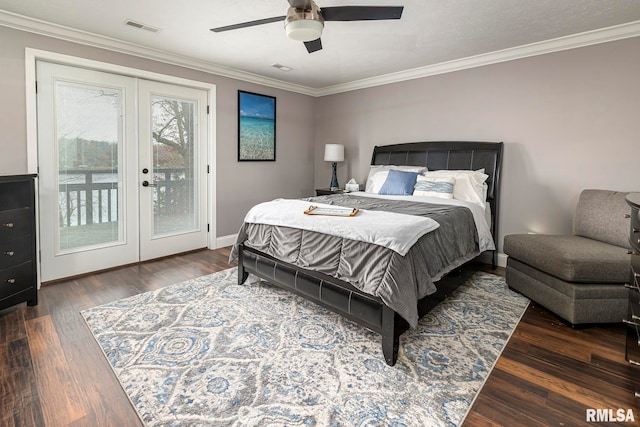 bedroom featuring access to exterior, french doors, dark hardwood / wood-style floors, and ceiling fan