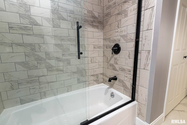 bathroom featuring bath / shower combo with glass door