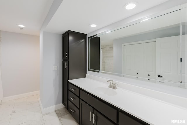 12225 Pebble Point Rd, Marion, IL 62959 - bathroom featuring vanity, baseboards, marble look tiles, and recessed lighting