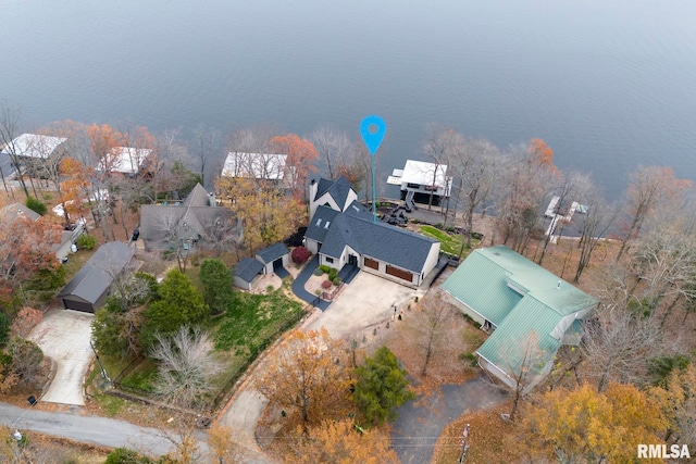 birds eye view of property featuring a water view