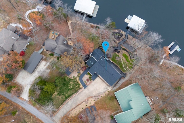 birds eye view of property featuring a water view