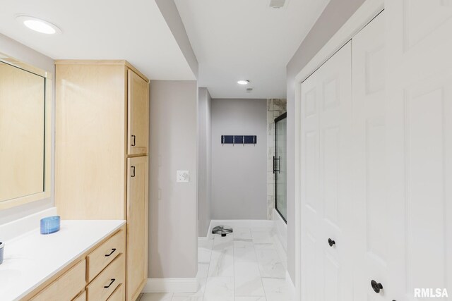 12225 Pebble Point Rd, Marion, IL 62959 - bathroom with baseboards, marble look tiles, a shower with shower door, vanity, and recessed lighting