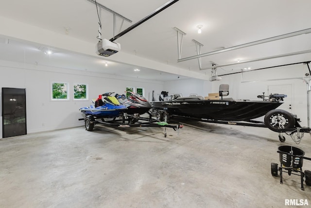 12225 Pebble Point Rd, Marion, IL 62959 - garage featuring a garage door opener