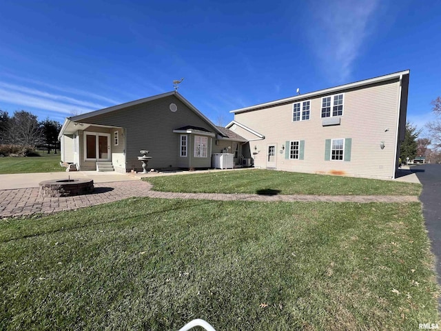 back of house with a lawn, central AC, and a patio