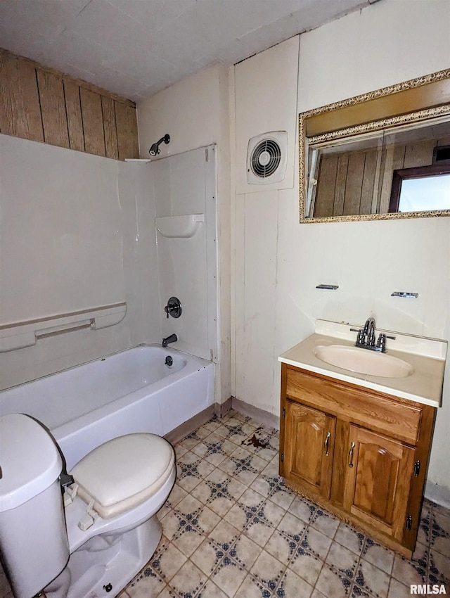 full bathroom with vanity, toilet, and  shower combination