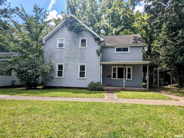 207 E Oak St, Carbondale, IL 62901 - traditional-style house featuring a front lawn and covered porch