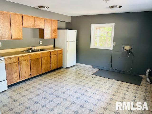 kitchen with white fridge and sink