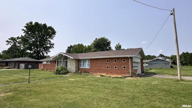 1107 E Cleveland St, West Frankfort, IL 62896 - ranch-style house with brick siding, a front lawn, and a garage