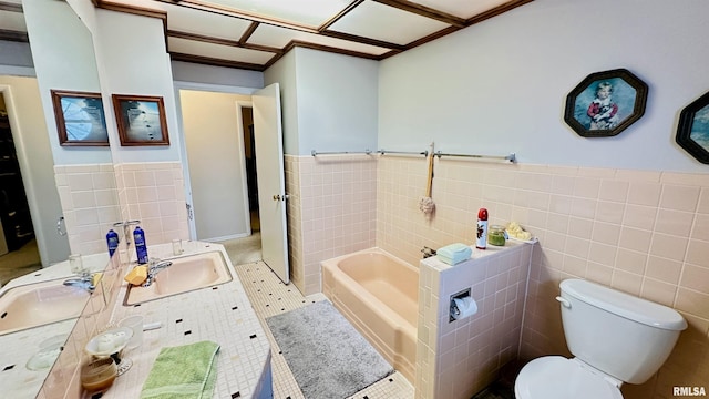 bathroom with a bathing tub, toilet, and tile walls