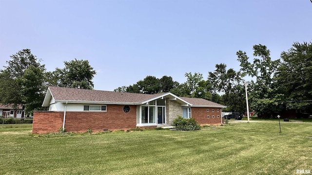 1107 E Cleveland St, West Frankfort, IL 62896 - rear view of property featuring brick siding and a lawn