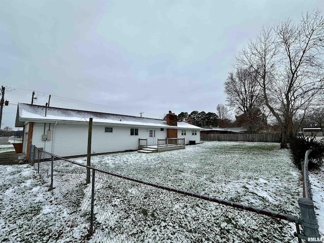 snow covered property featuring a deck