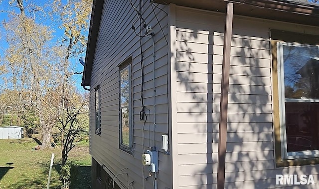 view of home's exterior with a lawn