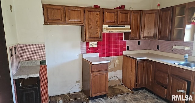 kitchen with tasteful backsplash and sink