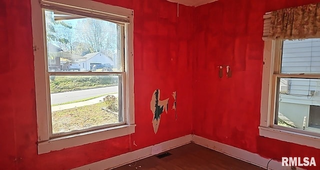 spare room with wood-type flooring