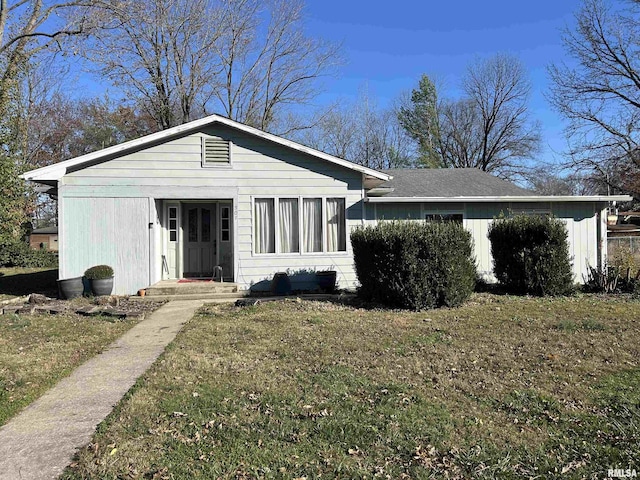 ranch-style home featuring a front yard