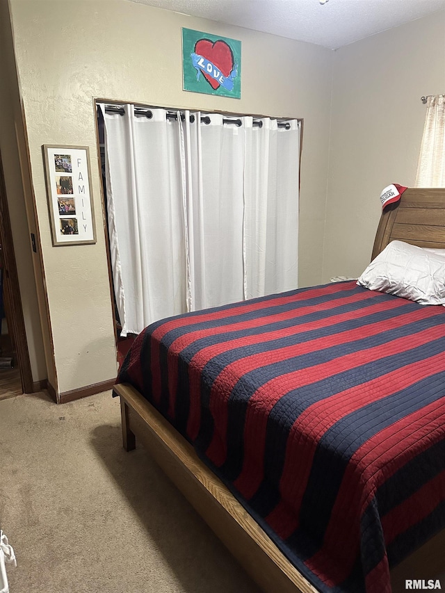 bedroom featuring carpet