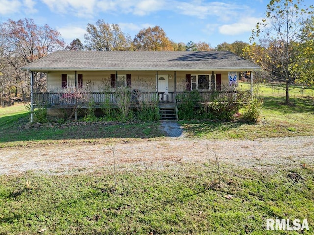 ranch-style house with covered porch and a front yard