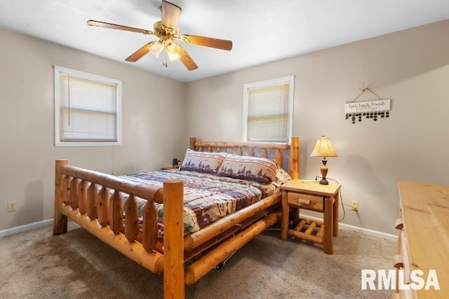 bedroom featuring ceiling fan and carpet