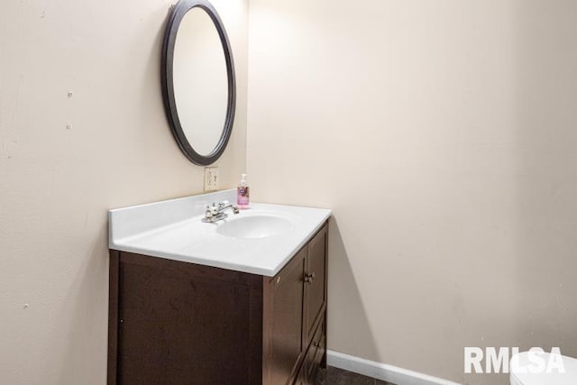 bathroom with vanity and toilet