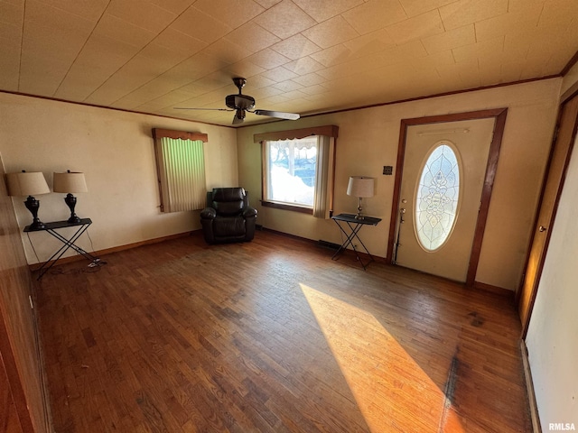 foyer entrance with ceiling fan and dark hardwood / wood-style floors