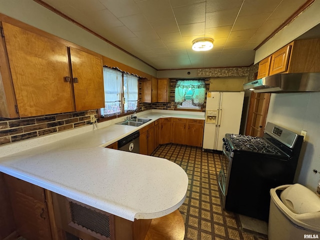 kitchen featuring white refrigerator with ice dispenser, sink, stainless steel dishwasher, gas stove, and kitchen peninsula