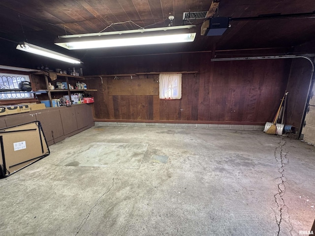 garage with wooden walls and wood ceiling