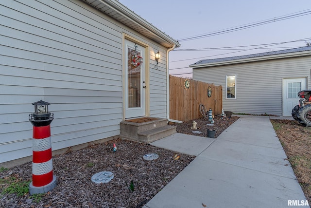 property entrance featuring a patio area