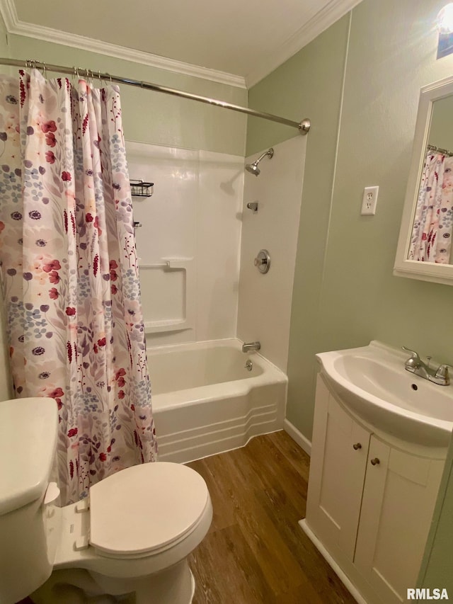 full bathroom with shower / tub combo, ornamental molding, vanity, wood-type flooring, and toilet