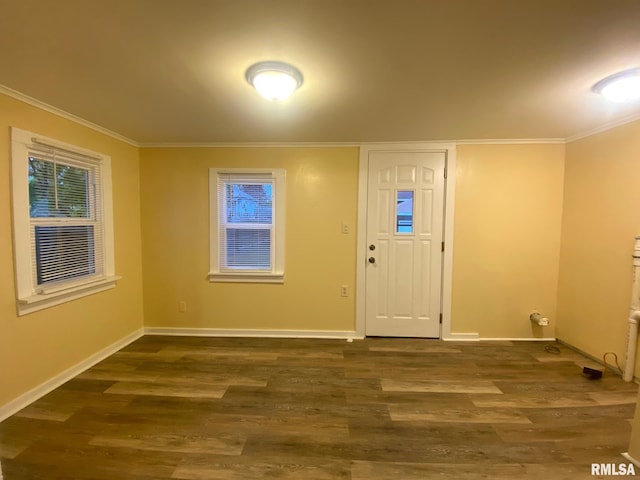 entryway with dark hardwood / wood-style flooring and ornamental molding