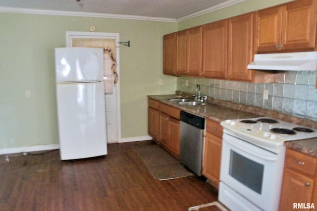 kitchen with backsplash, dark hardwood / wood-style floors, white appliances, and sink