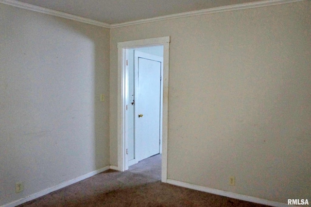 carpeted empty room featuring ornamental molding