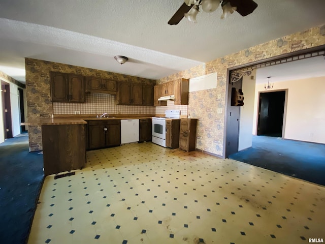 kitchen featuring dark brown cabinets, ceiling fan, white appliances, and a textured ceiling