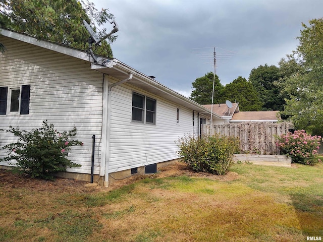 view of home's exterior featuring a lawn