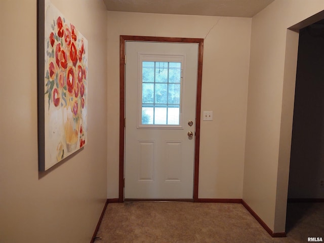 entryway with carpet floors