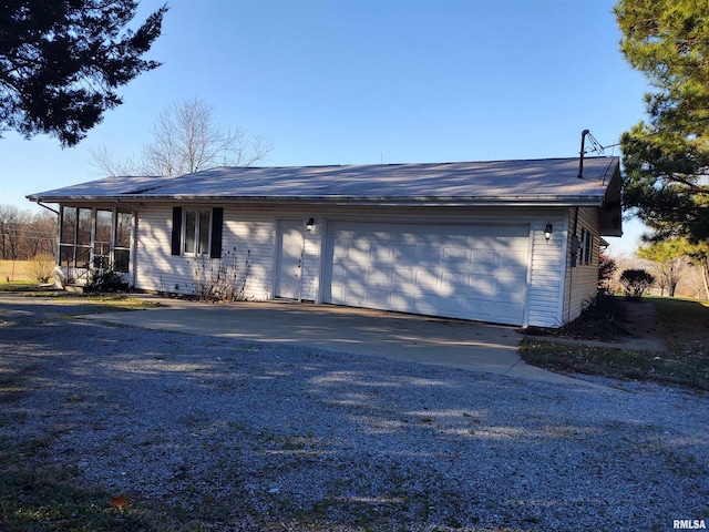 view of side of home with a garage